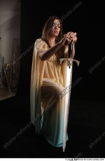 BARBORA KNEELING POSES WITH SWORD